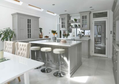 Clapham Painted Shaker Kitchen with a central island, dressers, glazed wall cabinets