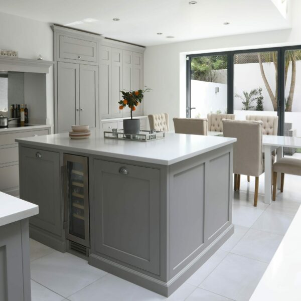 Clapham Painted Shaker Kitchen, looking over island into back garden, induction hob inside a chimney