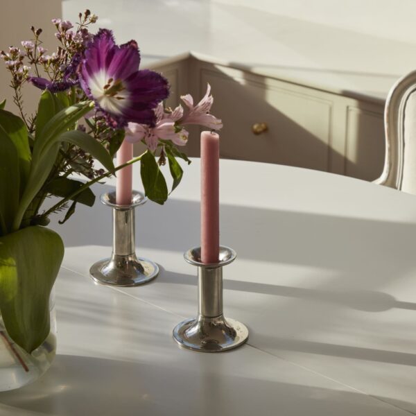 Herne Hill Painted Shaker Kitchen dining table with candle sticks and a bouquet of flowers