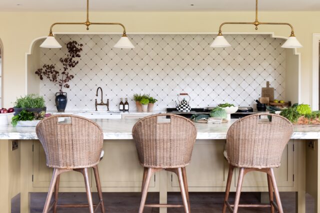 Handmade shaker kitchen by Higham Furniture with breakfast bar seating and marble worktop in London home