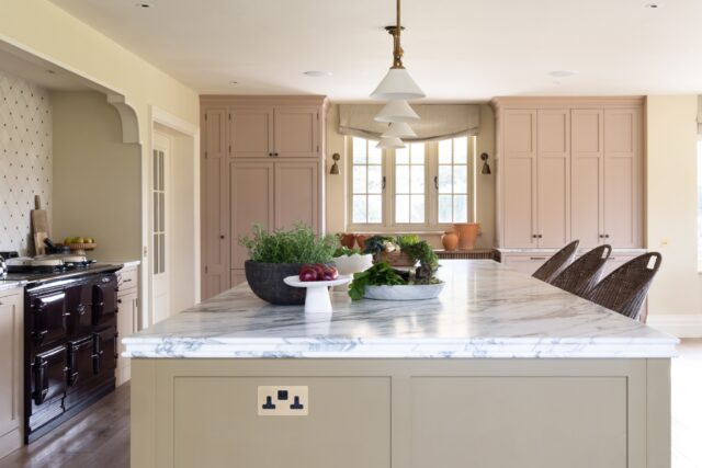 Handmade shaker kitchen with marble island and bespoke cabinetry by Higham Furniture